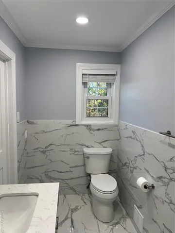 a bathroom with a sink and shower