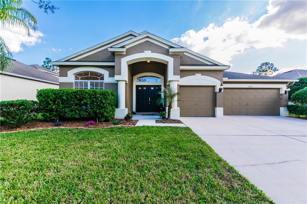 5902 Riva Ridge Drive Wesley Chapel, FL 33544 - Photo 1 of 1 front view of a house with a yard