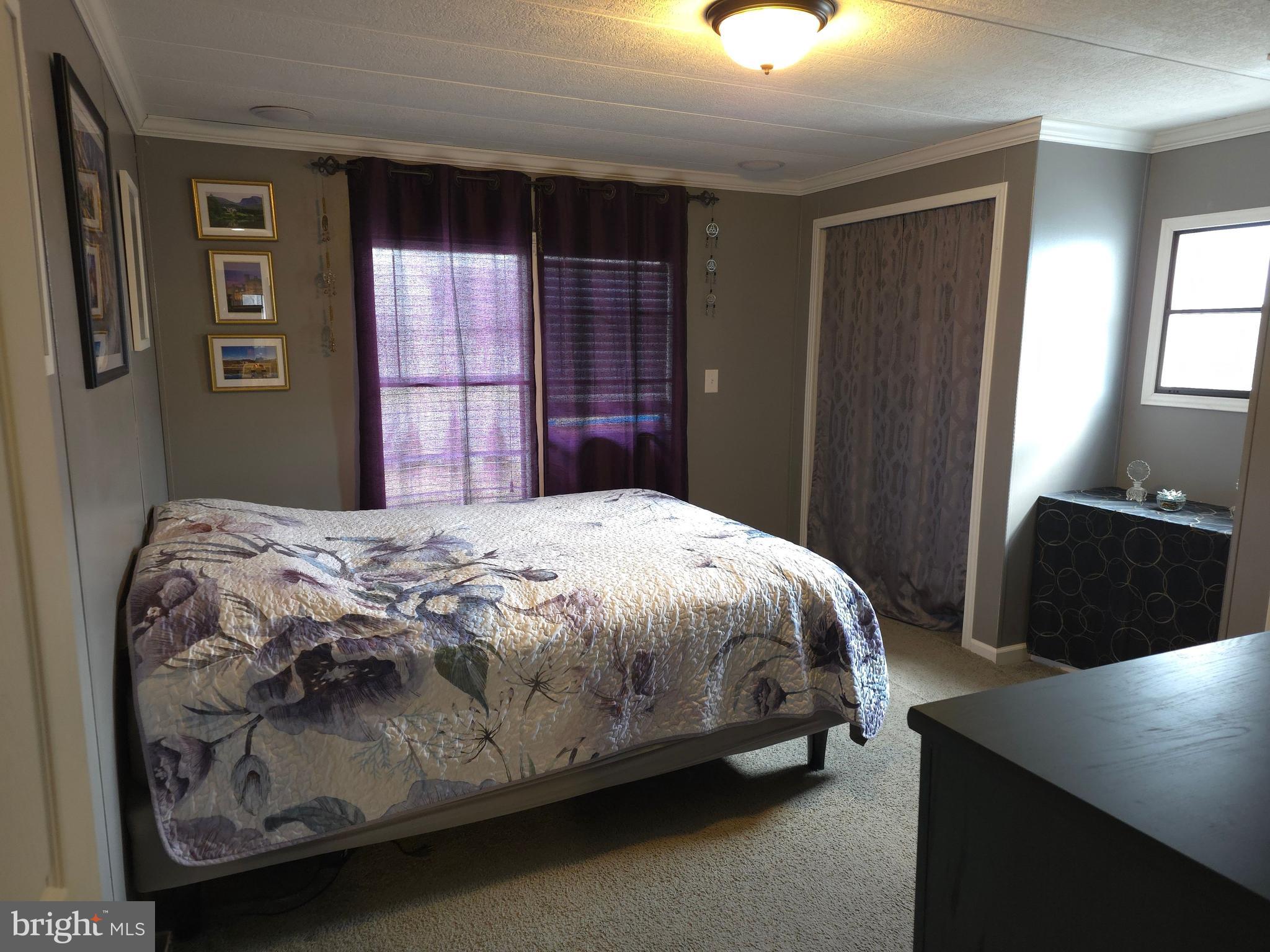 1008 Marticville Road Pequea, PA 17565 - Photo 14 of 27 a bedroom with a bed and a refrigerator