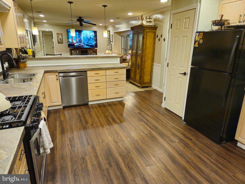 1008 Marticville Road Pequea, PA 17565 - Photo 8 of 27 a kitchen with stainless steel appliances granite countertop a refrigerator a stove and a wooden floors