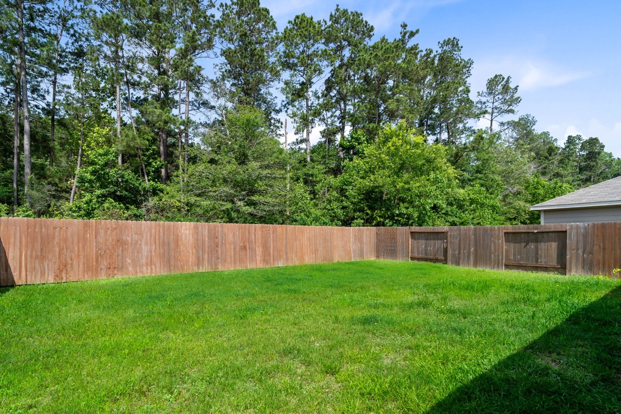 9931 Spring Creek Road Cleveland, TX 77327 - Photo 10 of 38 lush back yard