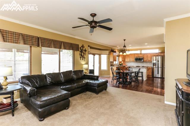 42745 Pearson Ranch Loop Parker, CO 80138 - Photo 10 of 36 Living Room Open to Dining Area and Kitchen