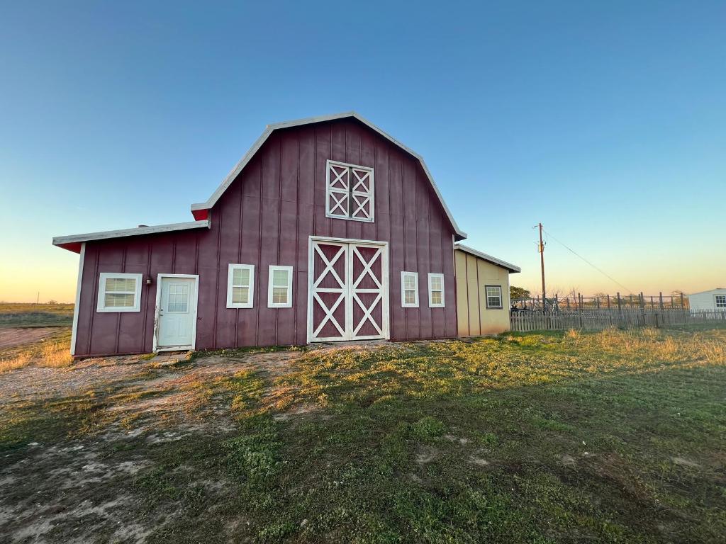 a house with lots of trees in the background