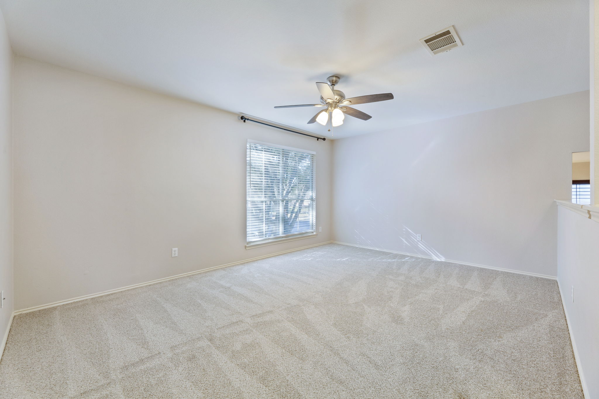1608 Melibee Trail Austin, TX 78748 - Photo 15 of 29 Carpeted spare room with ceiling fan and baseboards