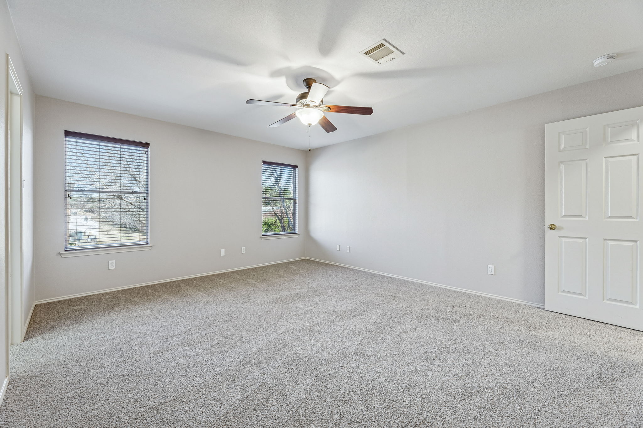 1608 Melibee Trail Austin, TX 78748 - Photo 18 of 29 Unfurnished room featuring light colored carpet and a ceiling fan