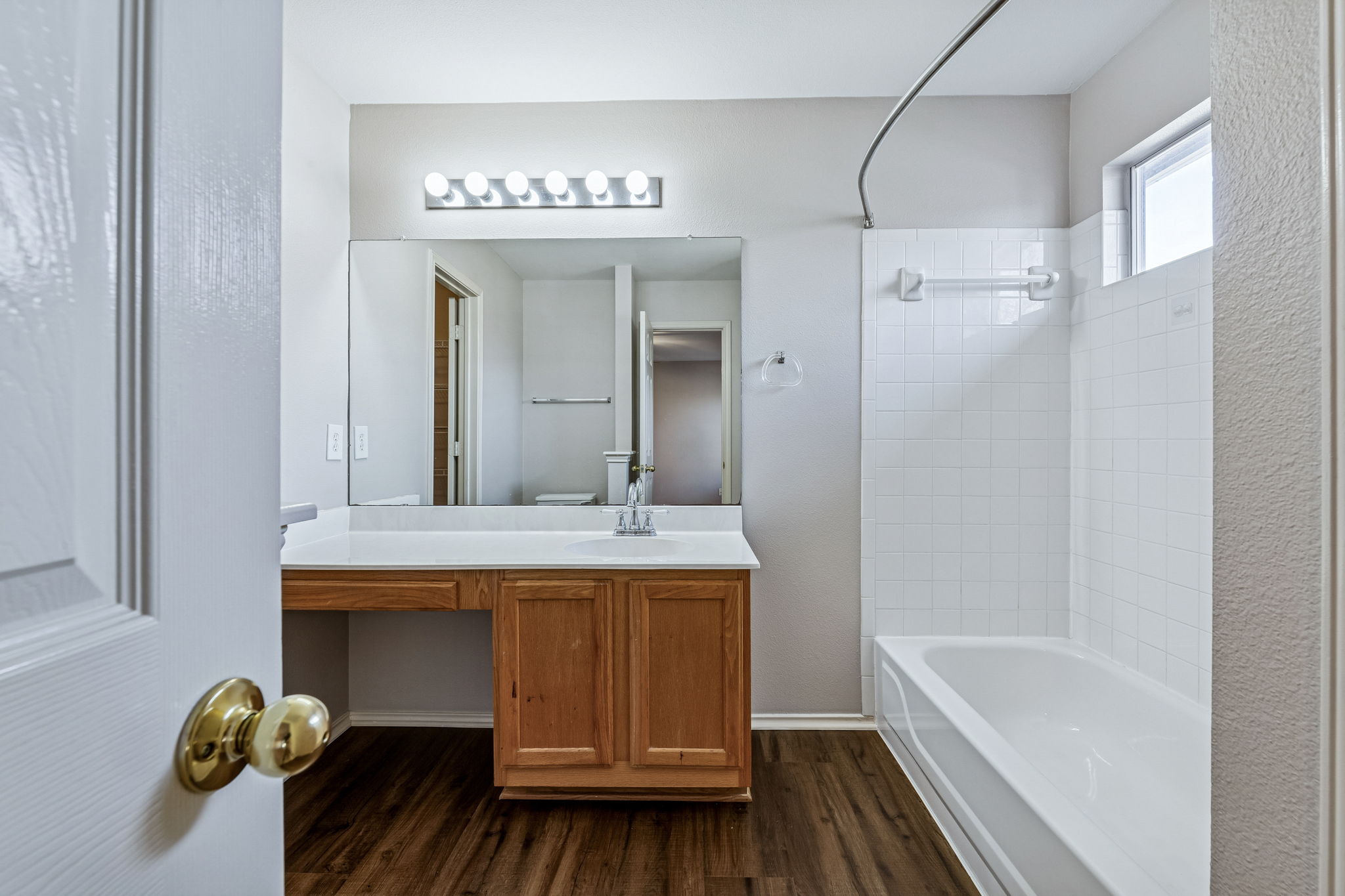 1608 Melibee Trail Austin, TX 78748 - Photo 20 of 29 Full bathroom featuring tub / shower combination, vanity, and dark wood-style flooring