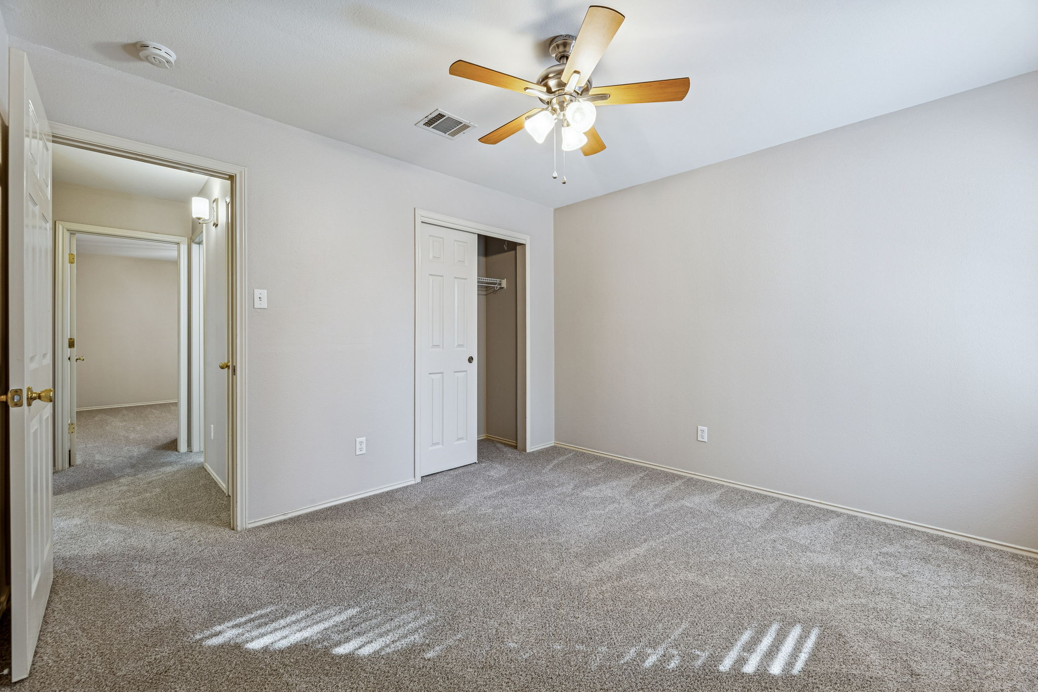 1608 Melibee Trail Austin, TX 78748 - Photo 22 of 29 Unfurnished bedroom featuring a closet, light colored carpet, and a ceiling fan