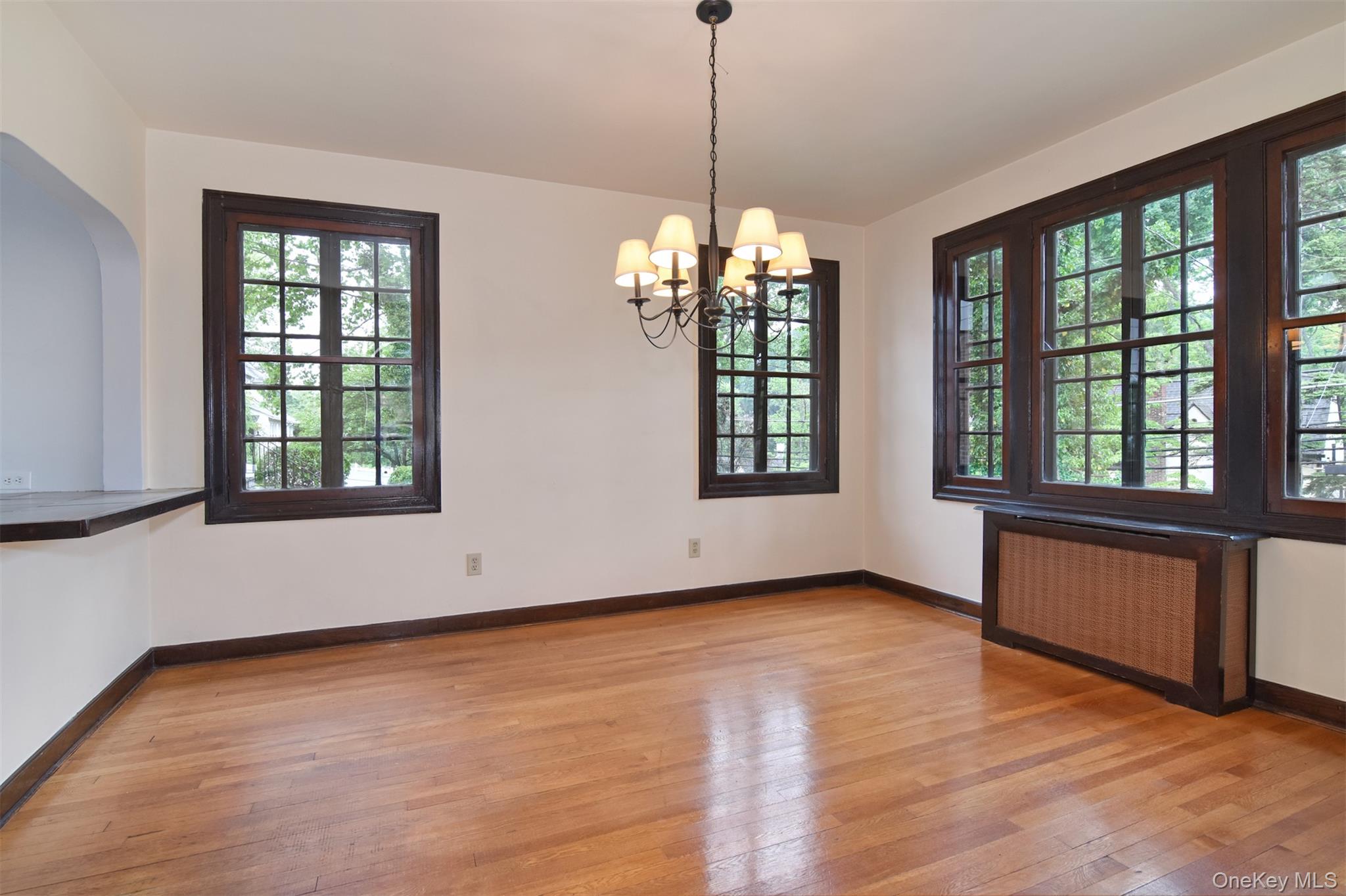 370 Scarsdale Road Tuckahoe, NY 10707 - Photo 12 of 25 Formal dining room with large windows and chandelier