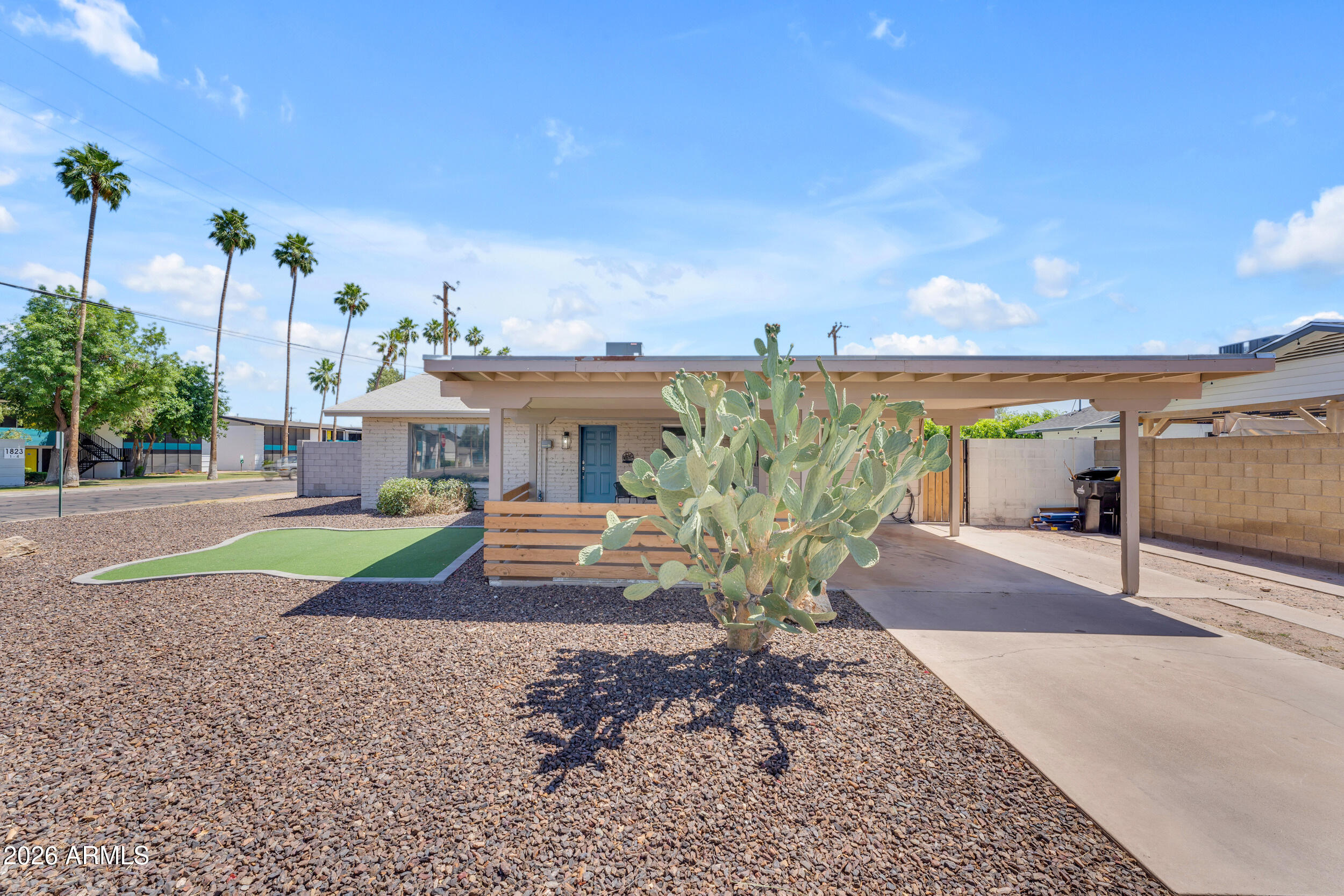6943 East Granada Road Scottsdale, AZ 85257 - Photo 19 of 19 a view of a house with garden and street view