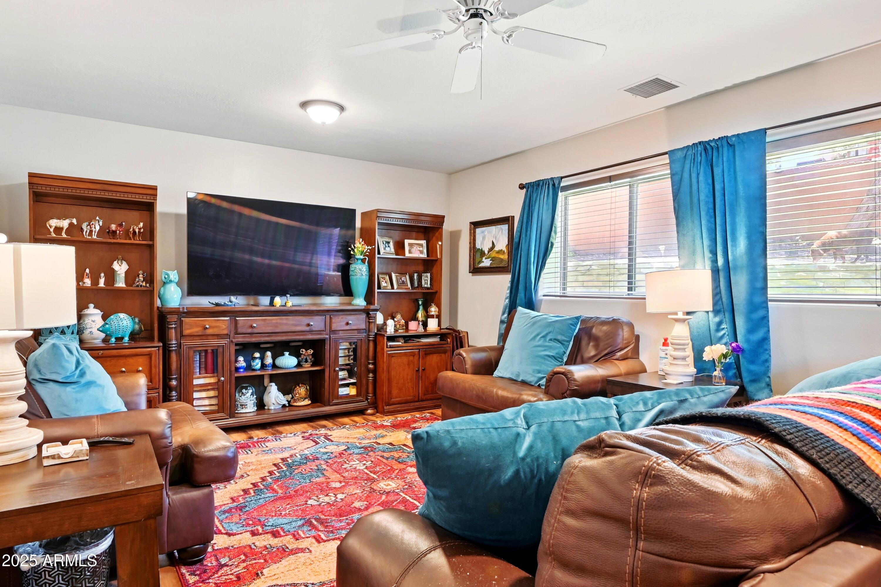 601 East Phoenix Street Payson, AZ 85541 - Photo 12 of 46 a bedroom with two beds and a flat screen tv