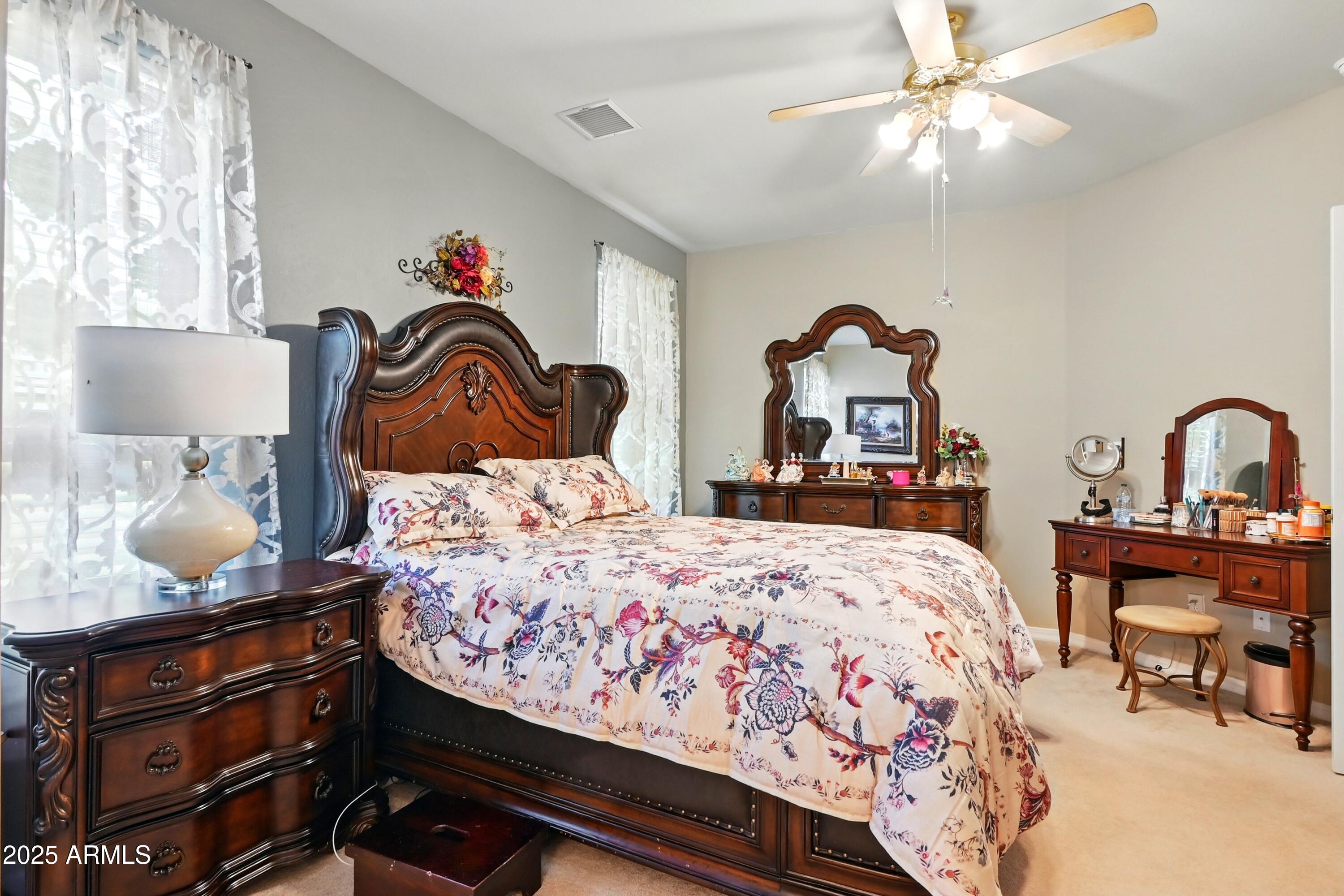 601 East Phoenix Street Payson, AZ 85541 - Photo 19 of 46 a bedroom with a bed and a chandelier