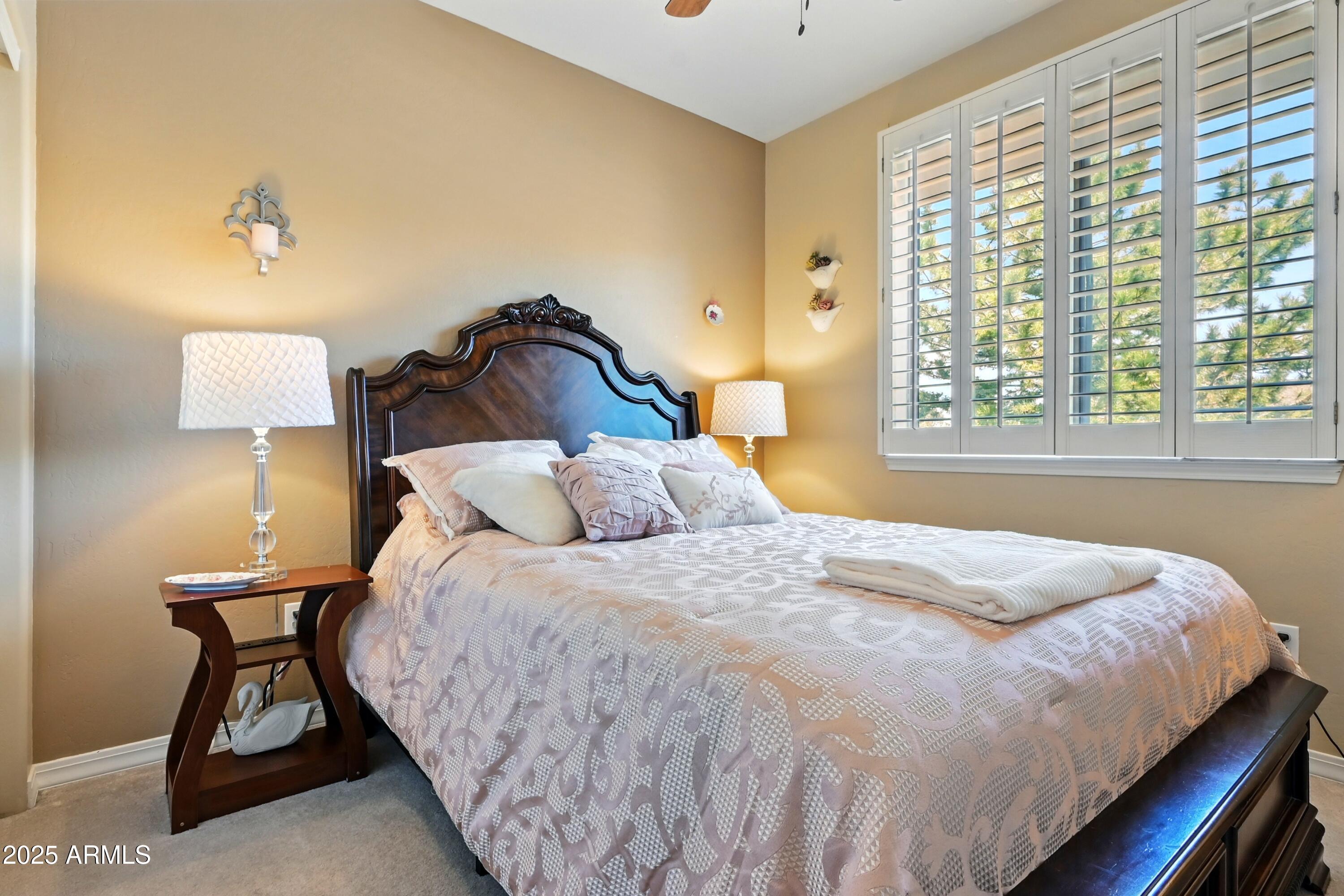 601 East Phoenix Street Payson, AZ 85541 - Photo 26 of 46 a bedroom with a bed and a lamp