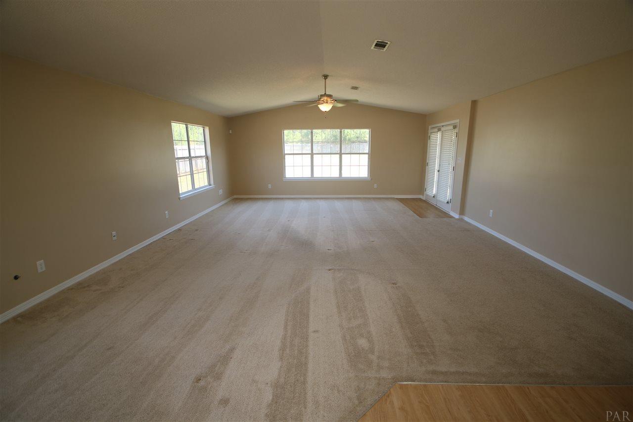 6256 Billoree Road Pace, FL 32571 - Photo 17 of 50 Cathedral height makes family room feel so large.
