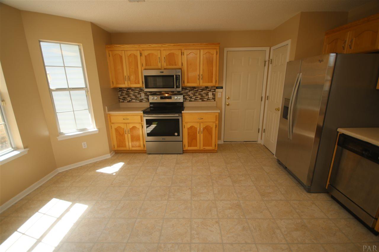 6256 Billoree Road Pace, FL 32571 - Photo 9 of 50 stove is garage entry & 2nd door is food pantry.