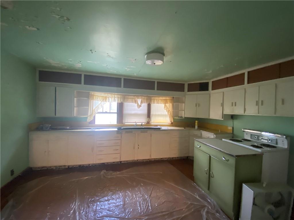 164-185 Cornfield Road Dayton, PA 16222 - Photo 15 of 25 a kitchen with a sink cabinets and window