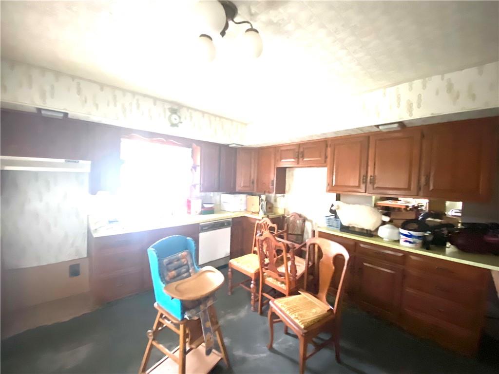 164-185 Cornfield Road Dayton, PA 16222 - Photo 20 of 25 a view of a dining room with furniture a kitchen and chandelier