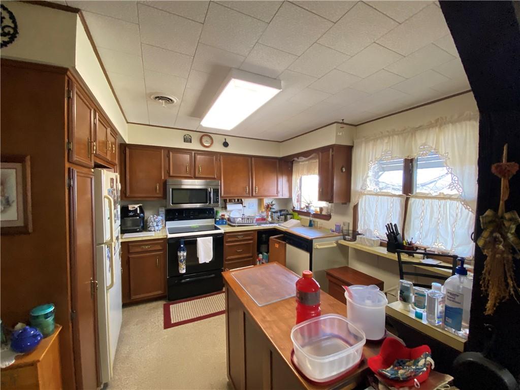 164-185 Cornfield Road Dayton, PA 16222 - Photo 25 of 25 a kitchen with a sink stove and cabinets