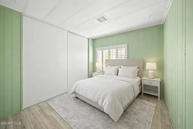 a bedroom with a bed and a walk in closet