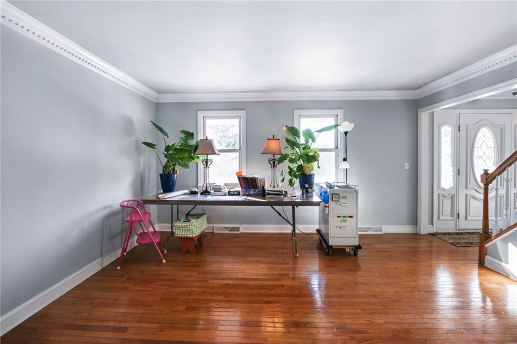 230 Ridge Avenue Pittsburgh, PA 15237 - Photo 5 of 25 a living room with furniture and a wooden floor