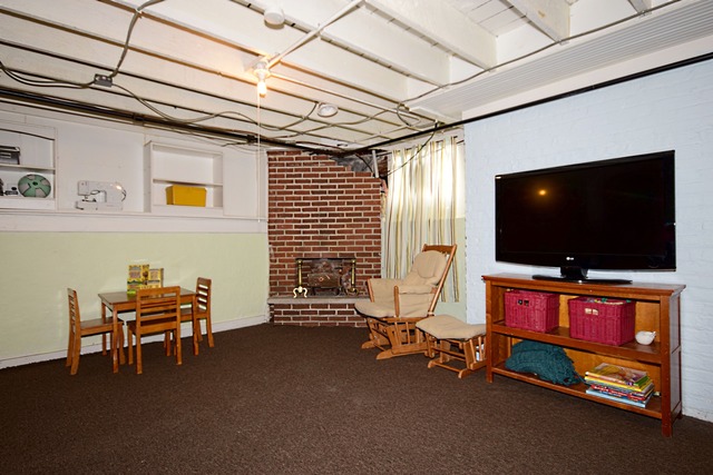 180 Fairbank Road Riverside, IL 60546 - Photo 22 of 25 a living room with furniture and a flat screen tv