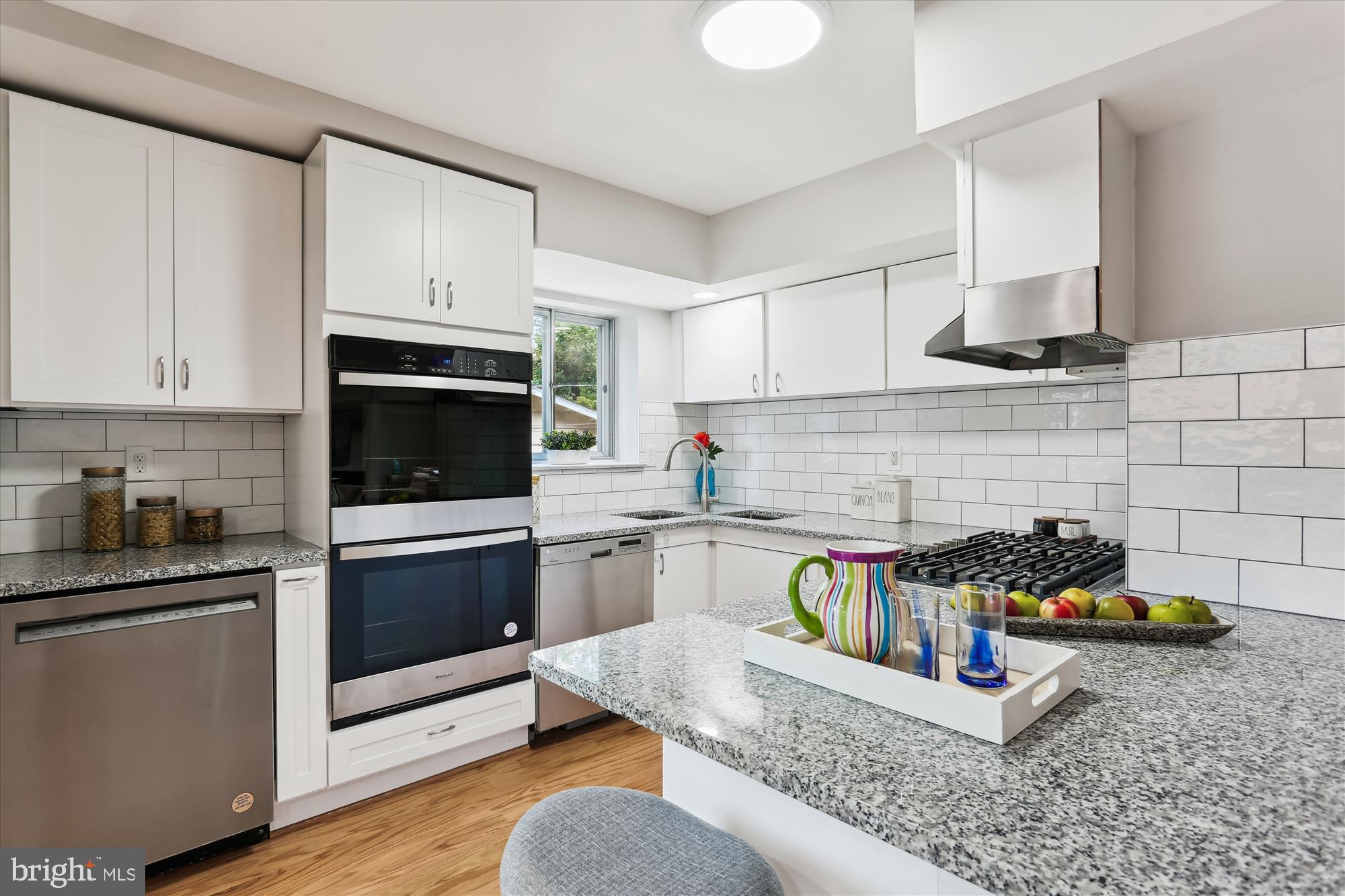 11524 Charlton Drive Silver Spring, MD 20902 - Photo 11 of 64 a kitchen with stainless steel appliances granite countertop a stove and a sink