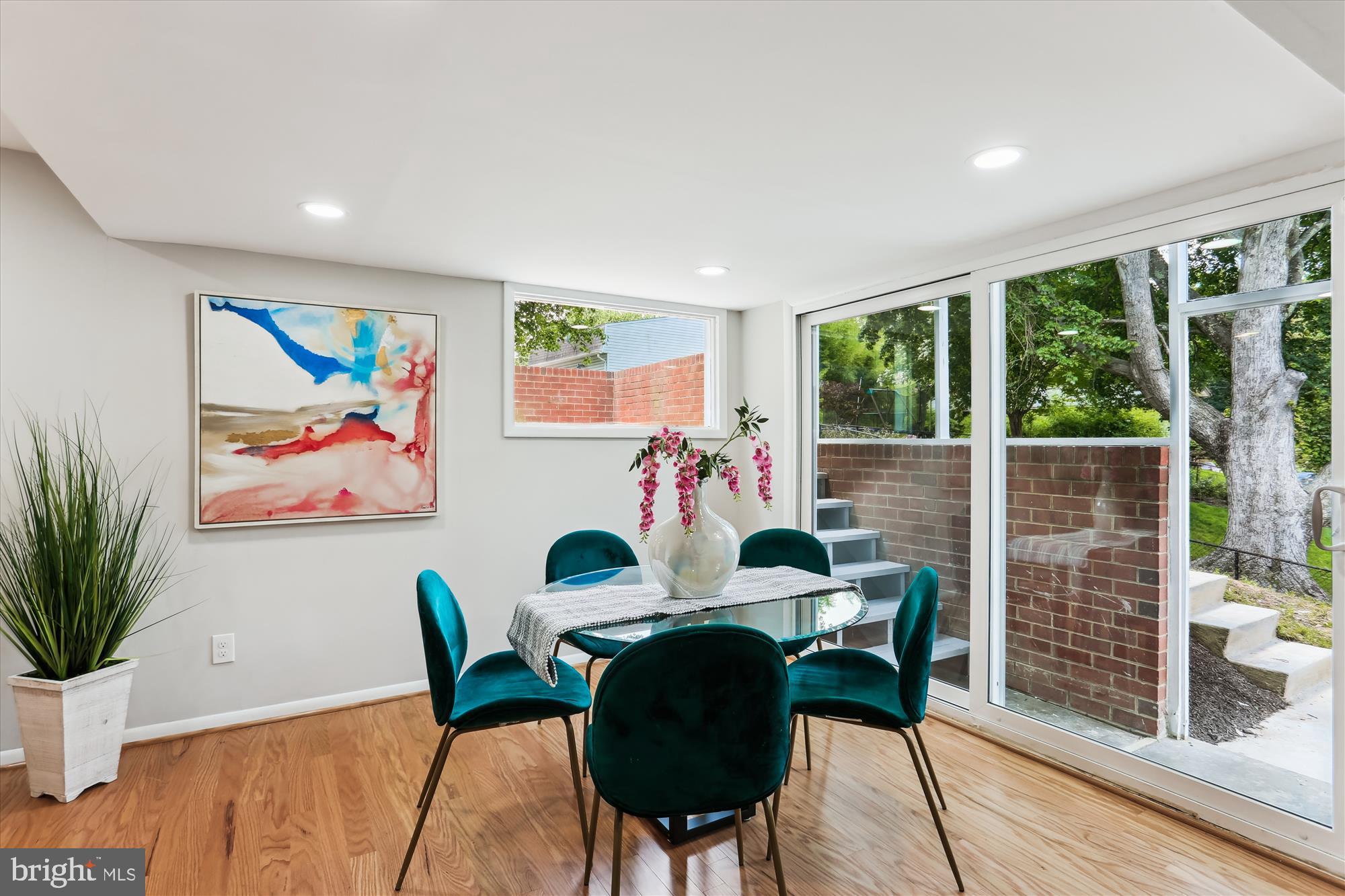 11524 Charlton Drive Silver Spring, MD 20902 - Photo 17 of 64 a view of a dining room with furniture window and wooden floor