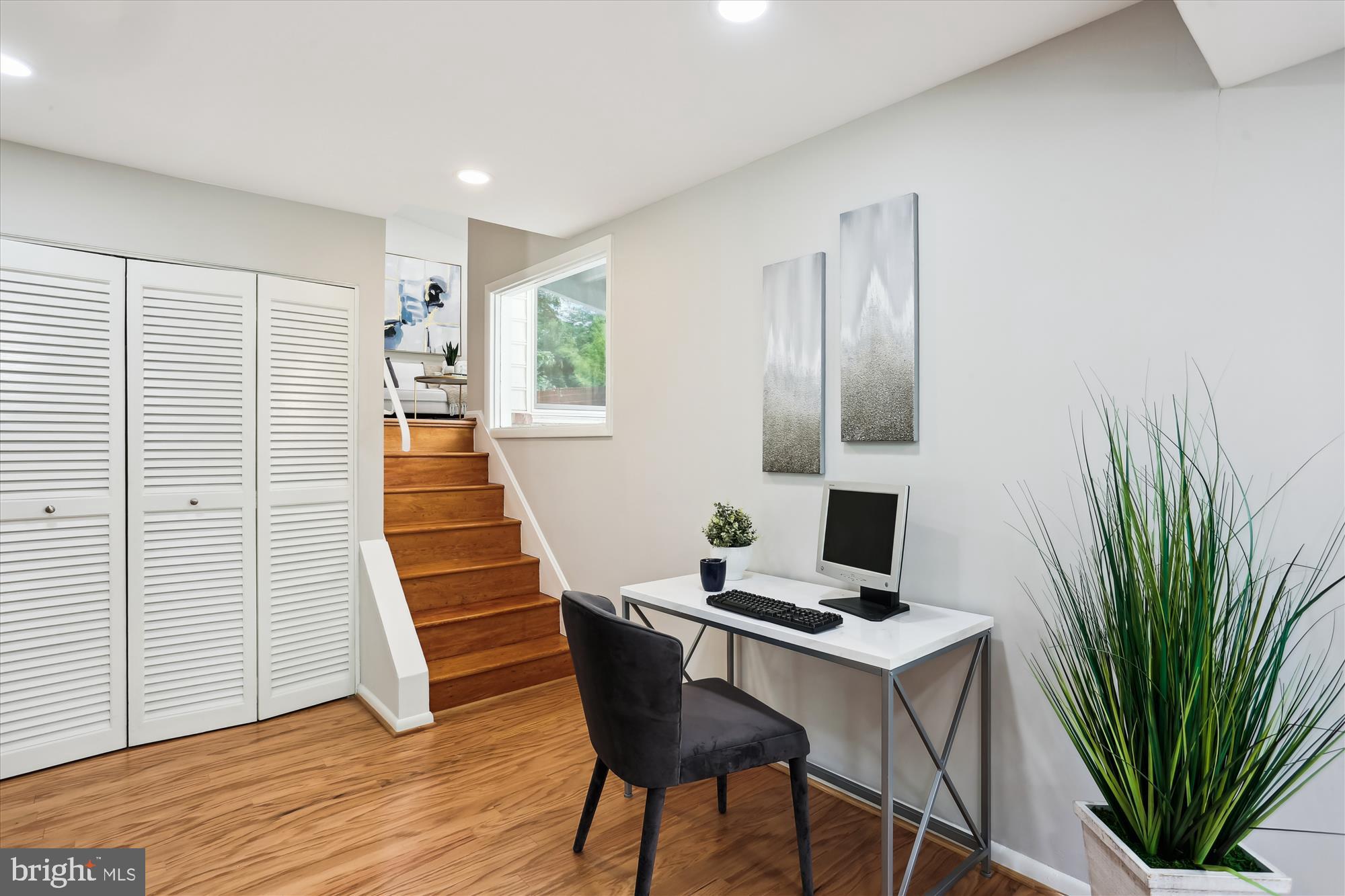 11524 Charlton Drive Silver Spring, MD 20902 - Photo 23 of 64 a workspace with furniture and wooden floor