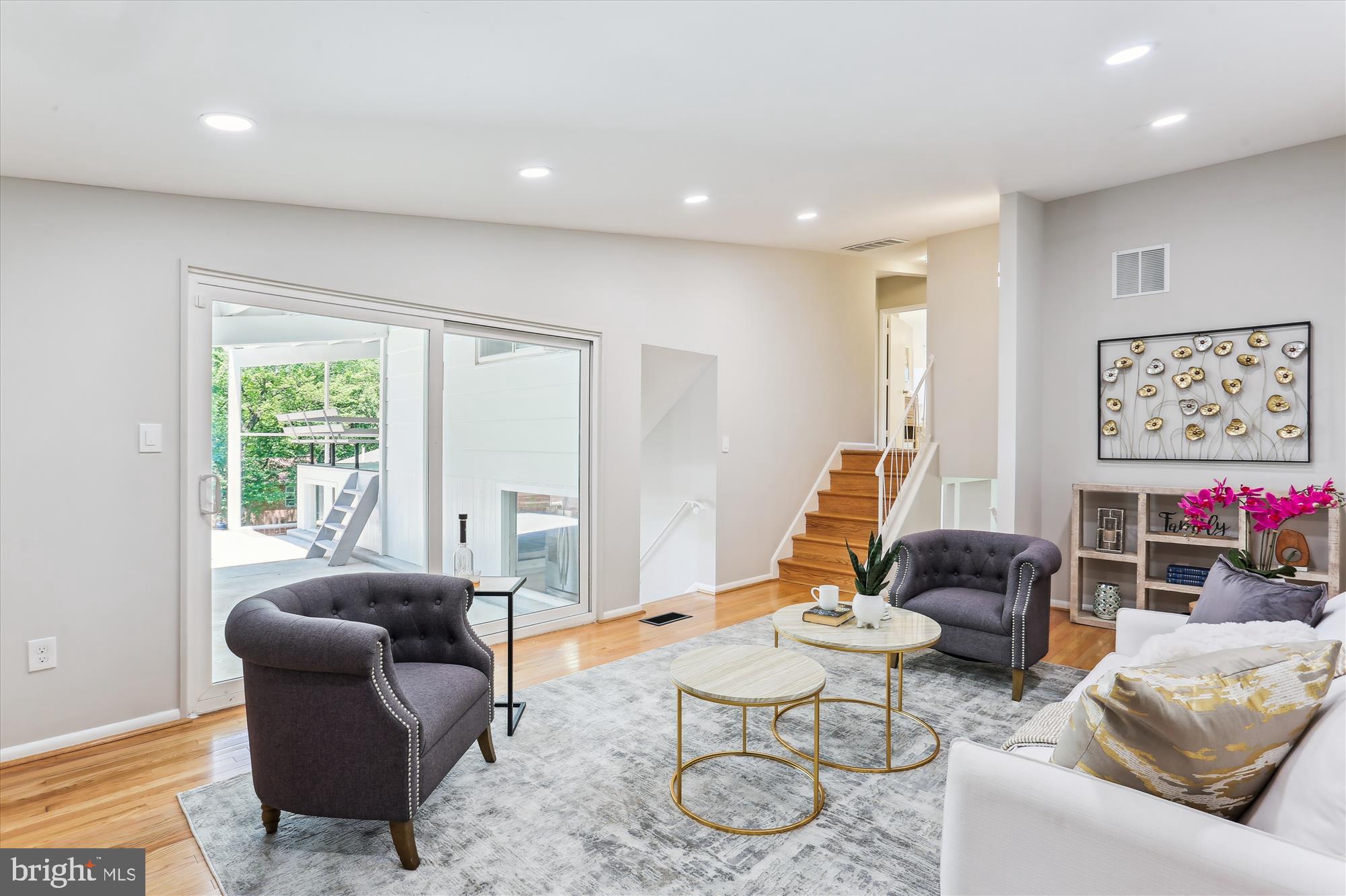 11524 Charlton Drive Silver Spring, MD 20902 - Photo 26 of 64 a living room with furniture and a large window