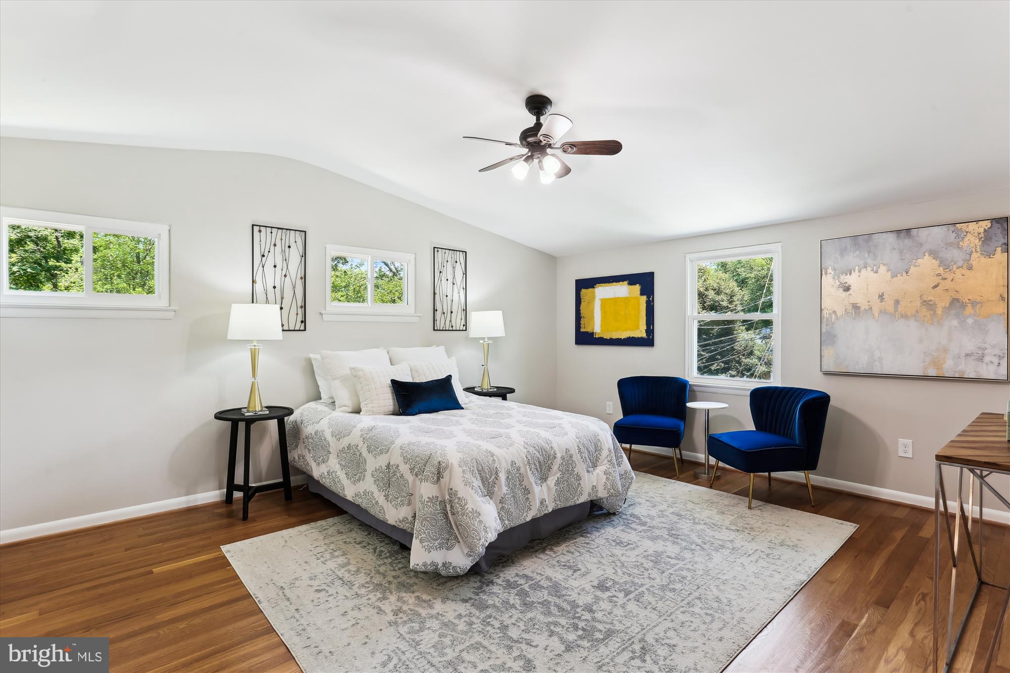 11524 Charlton Drive Silver Spring, MD 20902 - Photo 29 of 64 a bedroom with a bed wooden floor and a couch