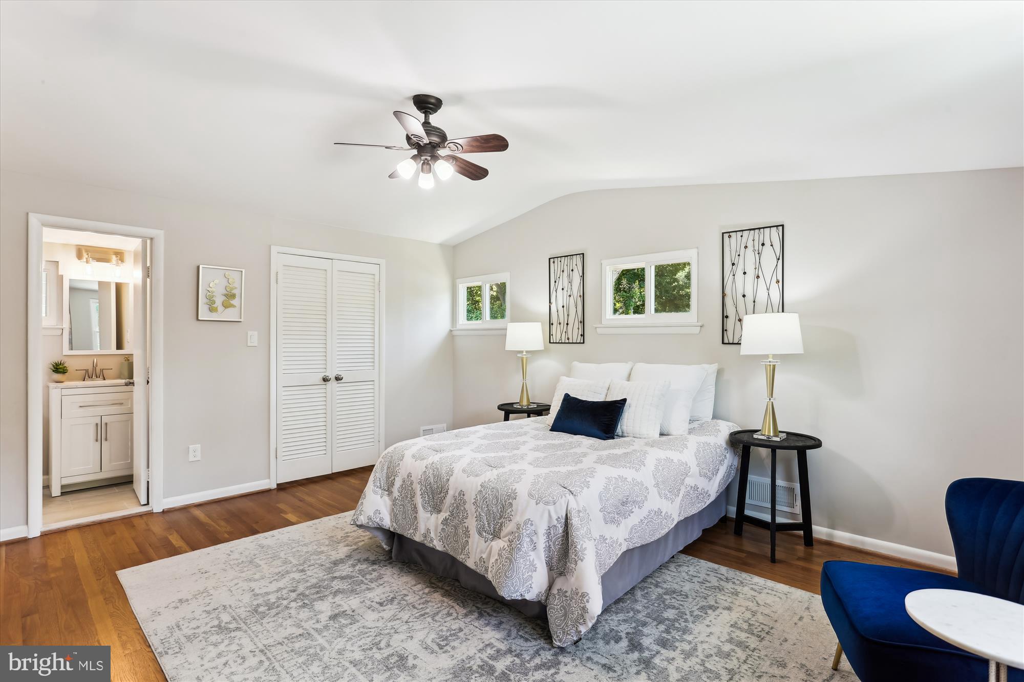 11524 Charlton Drive Silver Spring, MD 20902 - Photo 31 of 64 a bedroom with a bed and wooden floor
