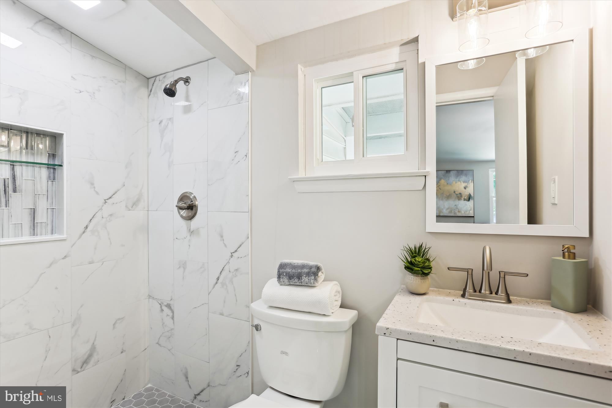 11524 Charlton Drive Silver Spring, MD 20902 - Photo 32 of 64 a bathroom with a sink toilet and shower