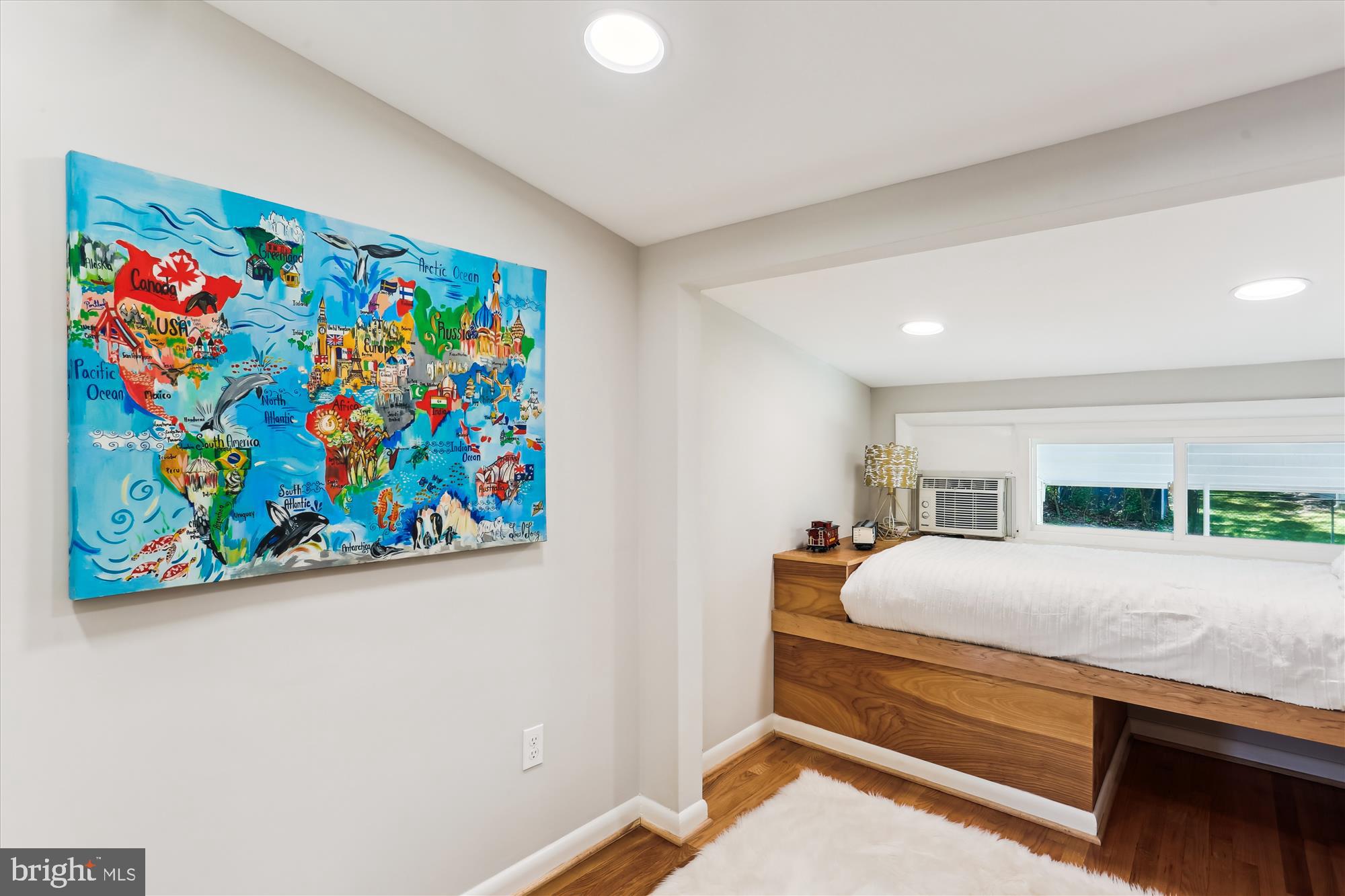 11524 Charlton Drive Silver Spring, MD 20902 - Photo 42 of 64 a bedroom with a bed and a painting on the wall