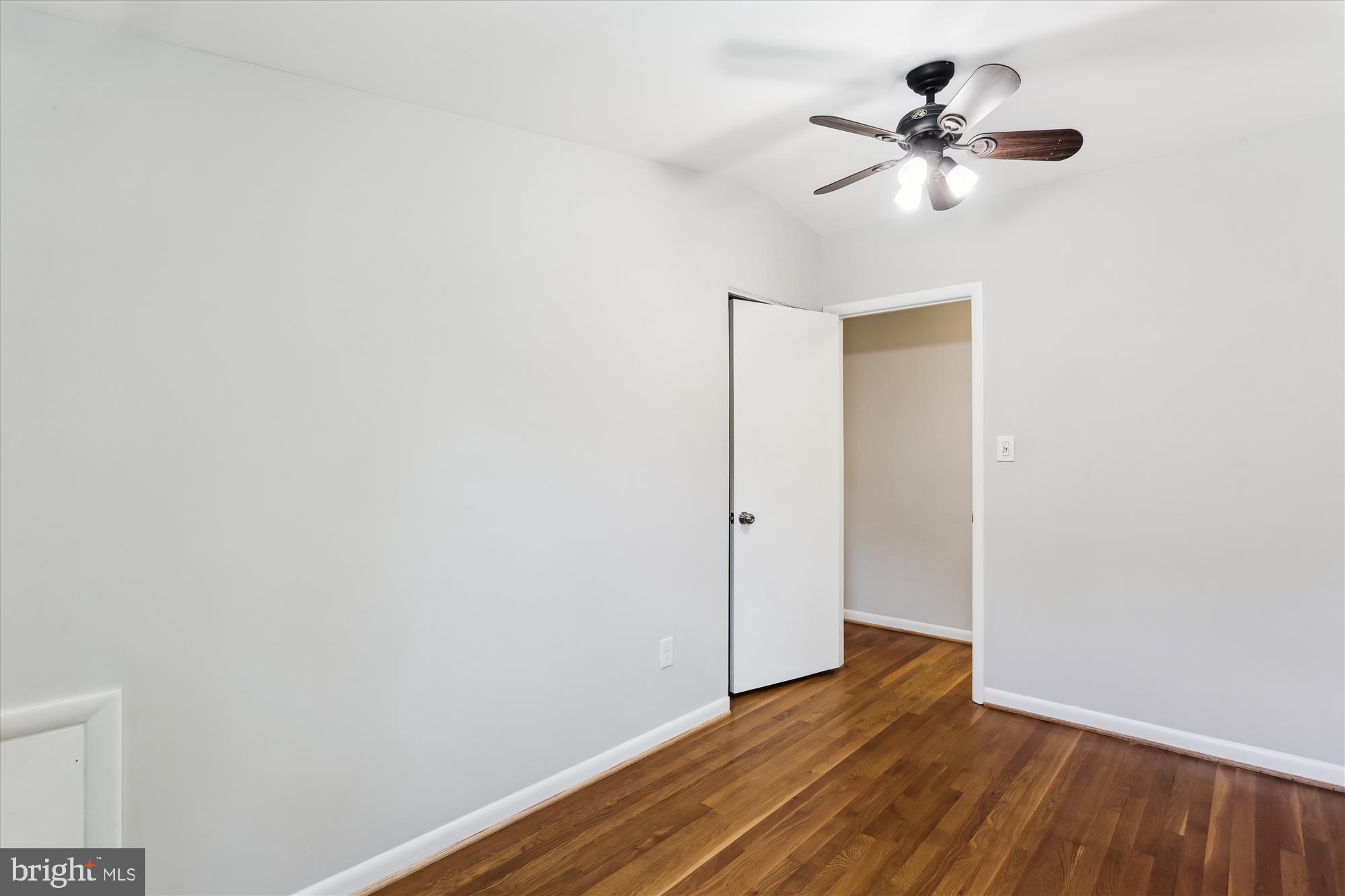 11524 Charlton Drive Silver Spring, MD 20902 - Photo 44 of 64 a view of room with hardwood floor and ceiling fan