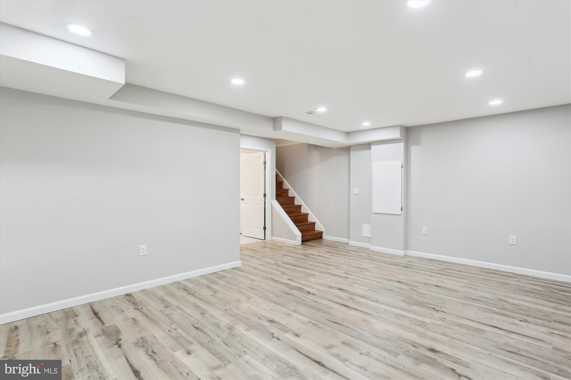 11524 Charlton Drive Silver Spring, MD 20902 - Photo 46 of 64 a view of an empty room with wooden floor