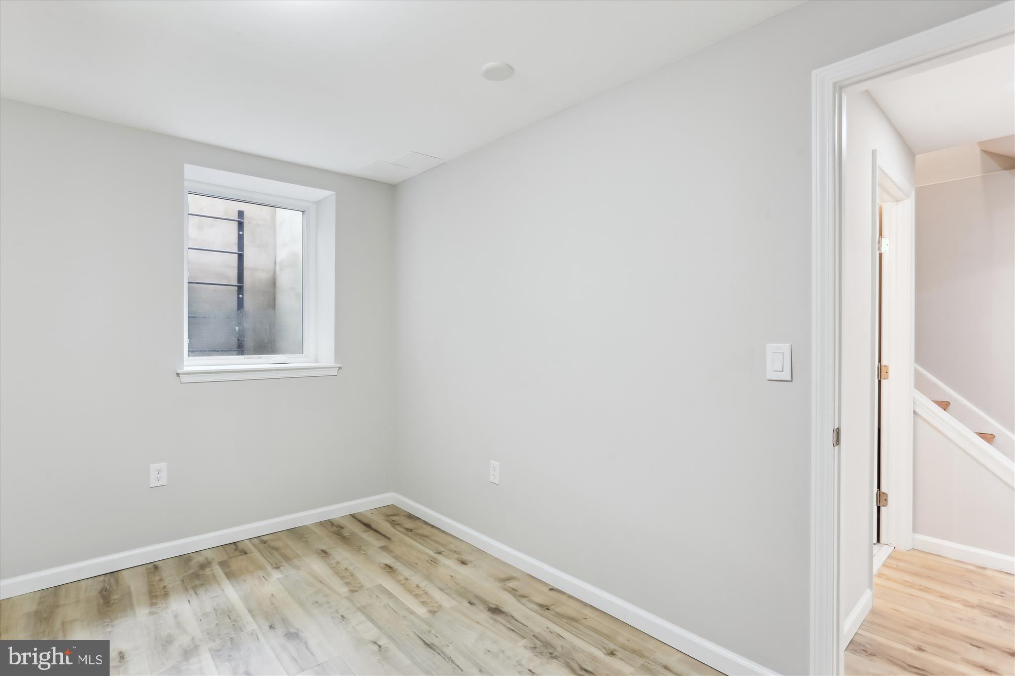 11524 Charlton Drive Silver Spring, MD 20902 - Photo 49 of 64 a view of a small space with wooden floor and a window
