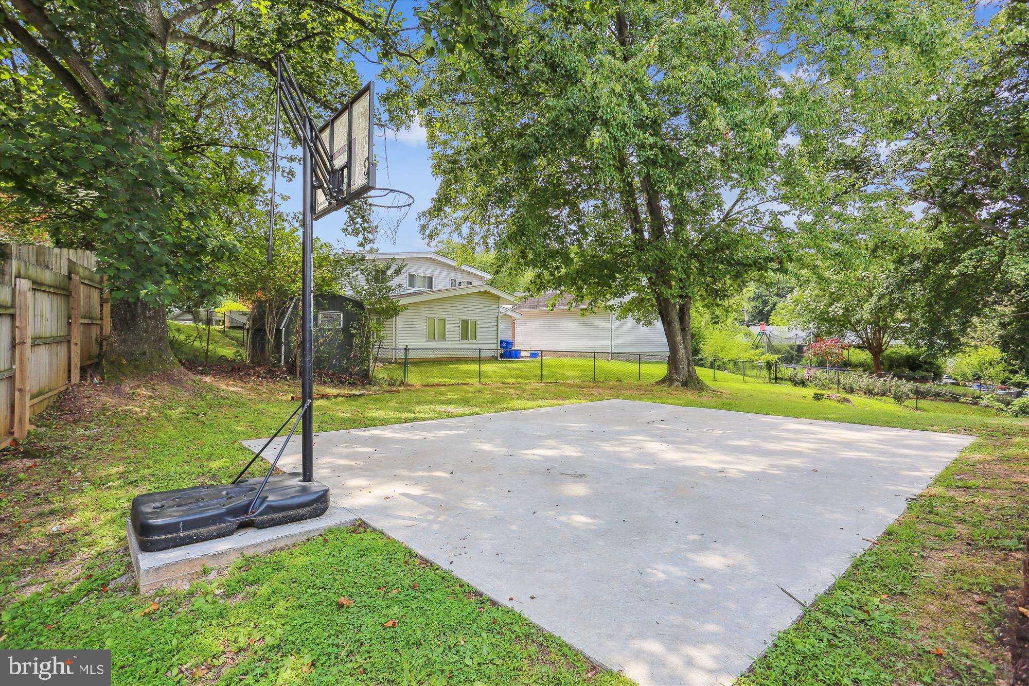 11524 Charlton Drive Silver Spring, MD 20902 - Photo 58 of 64 a view of a house with garden and a tree