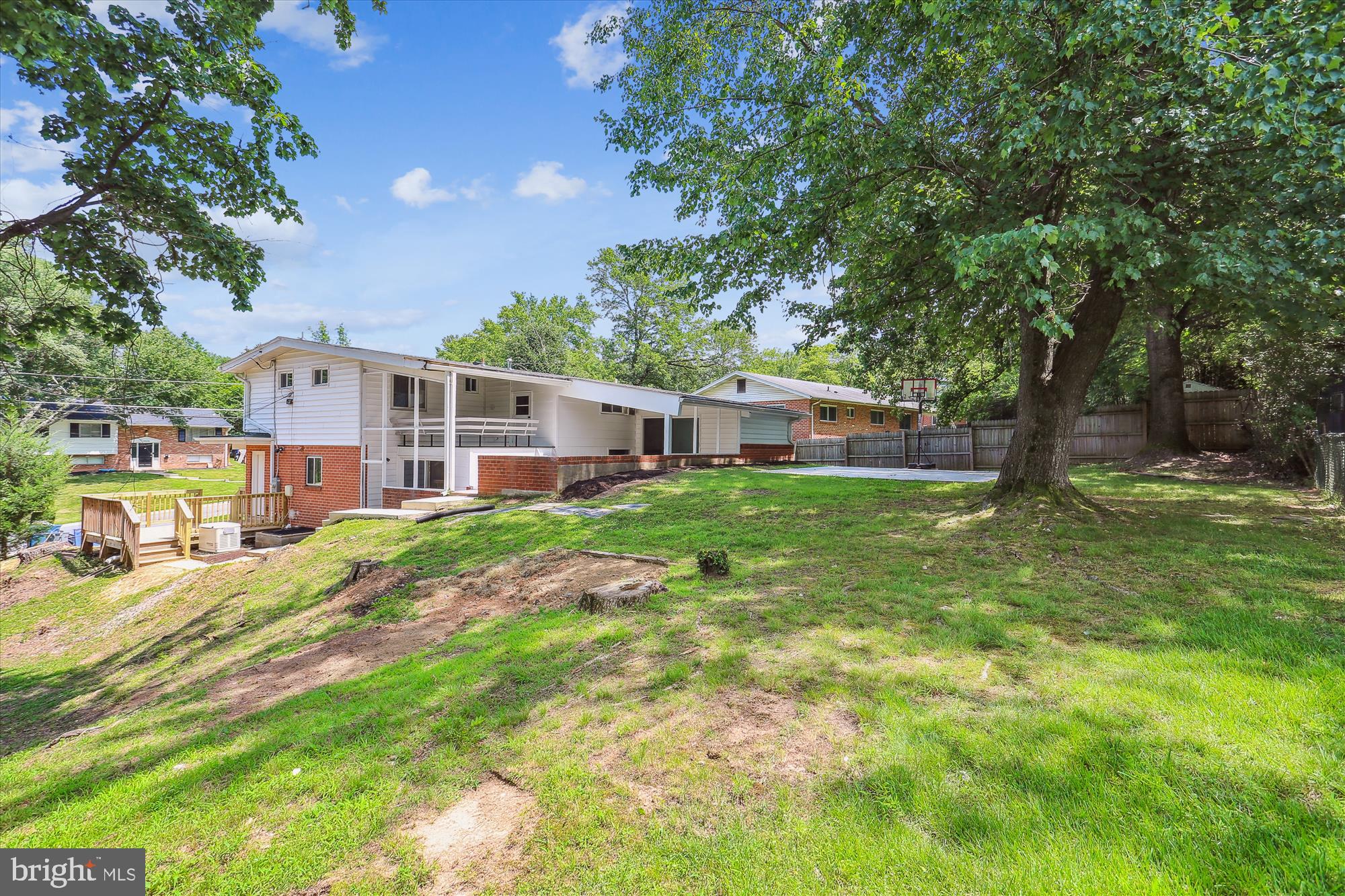 11524 Charlton Drive Silver Spring, MD 20902 - Photo 60 of 64 a view of a house with a big yard and large trees
