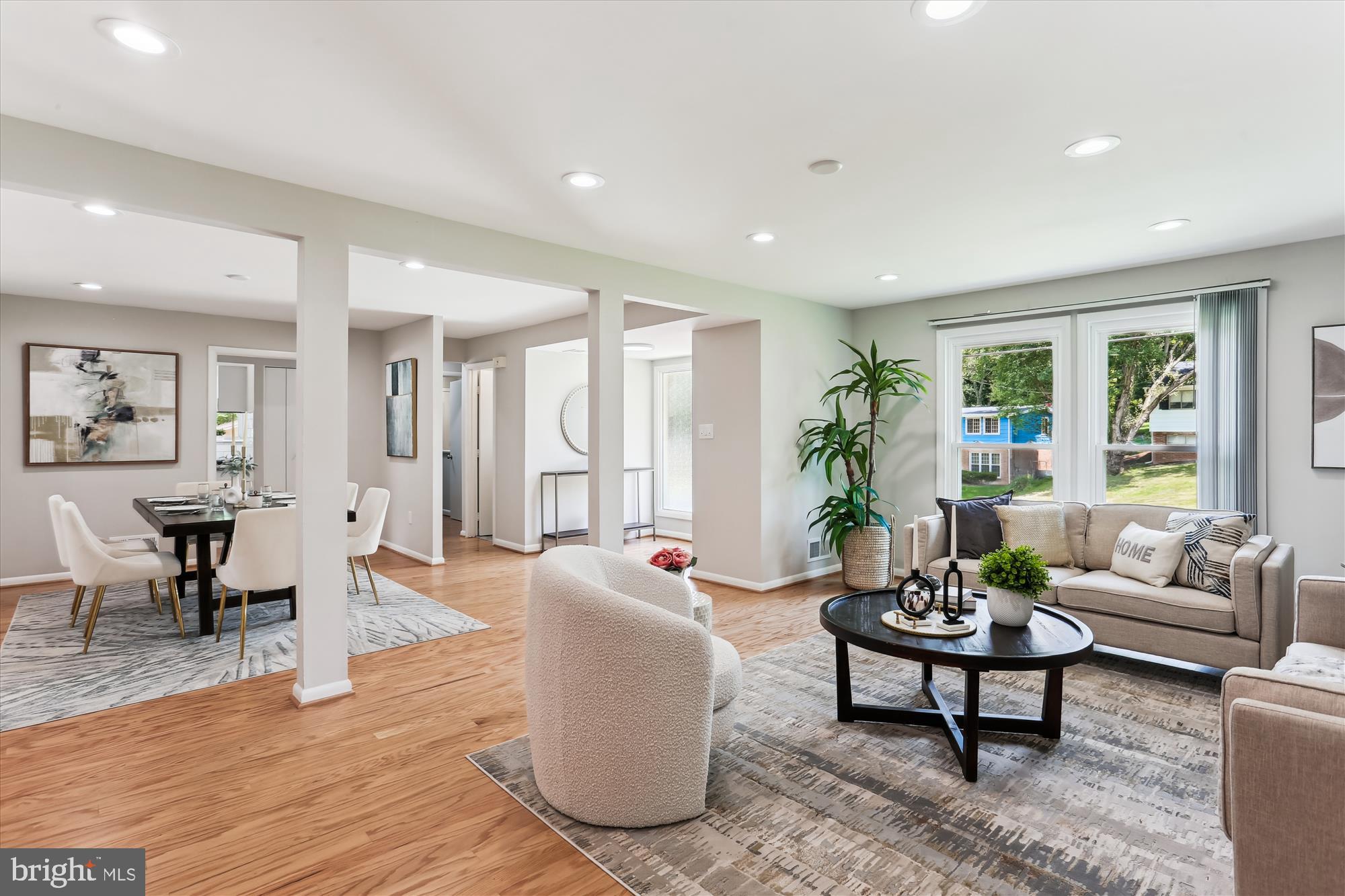 11524 Charlton Drive Silver Spring, MD 20902 - Photo 6 of 64 a living room with furniture potted plant and windows