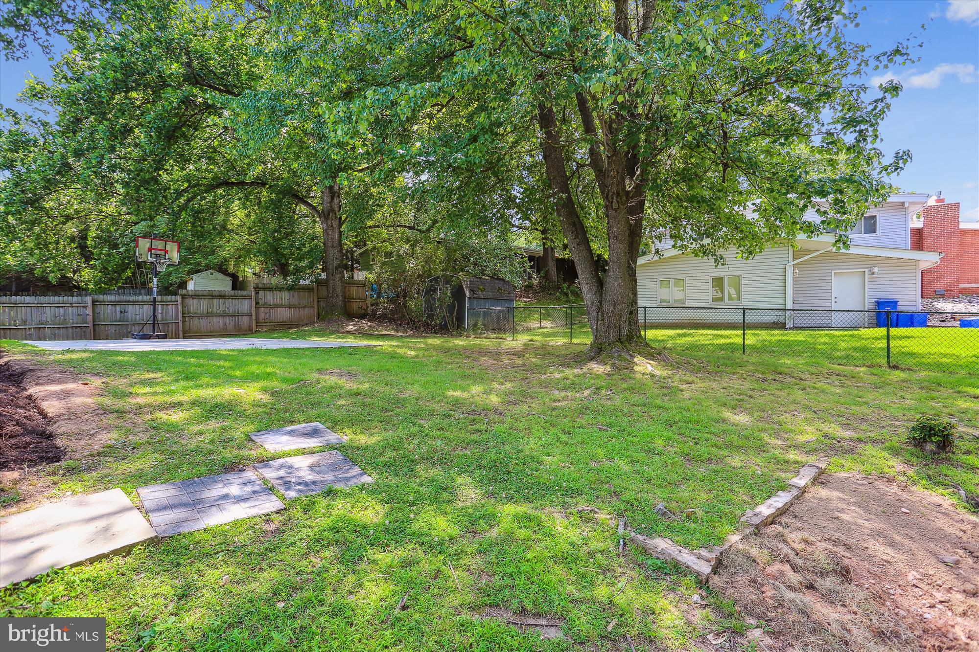 11524 Charlton Drive Silver Spring, MD 20902 - Photo 61 of 64 a backyard of a house with lots of green space and fountain