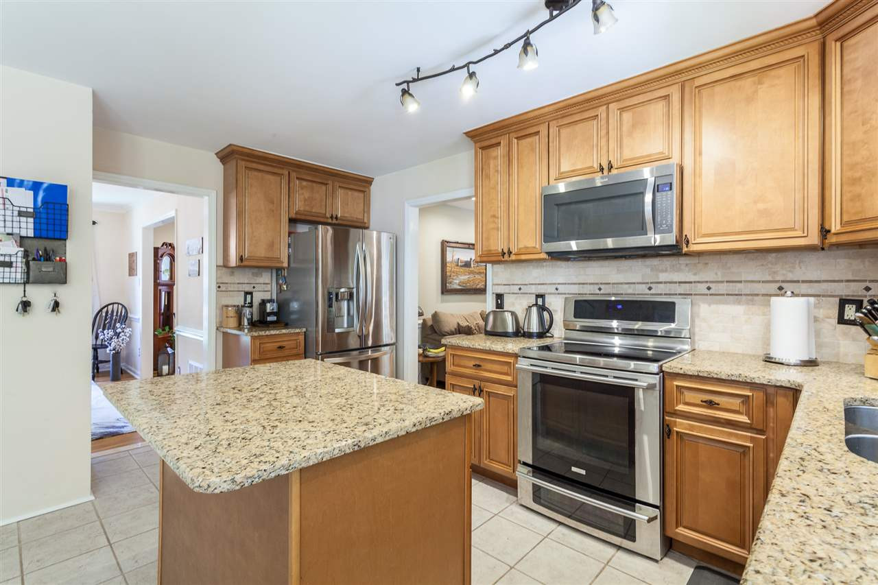 8709 Kenilworth Drive Raleigh, NC 27613 - Photo 13 of 30 touts stainless steel appliances and granite counters Kitchen