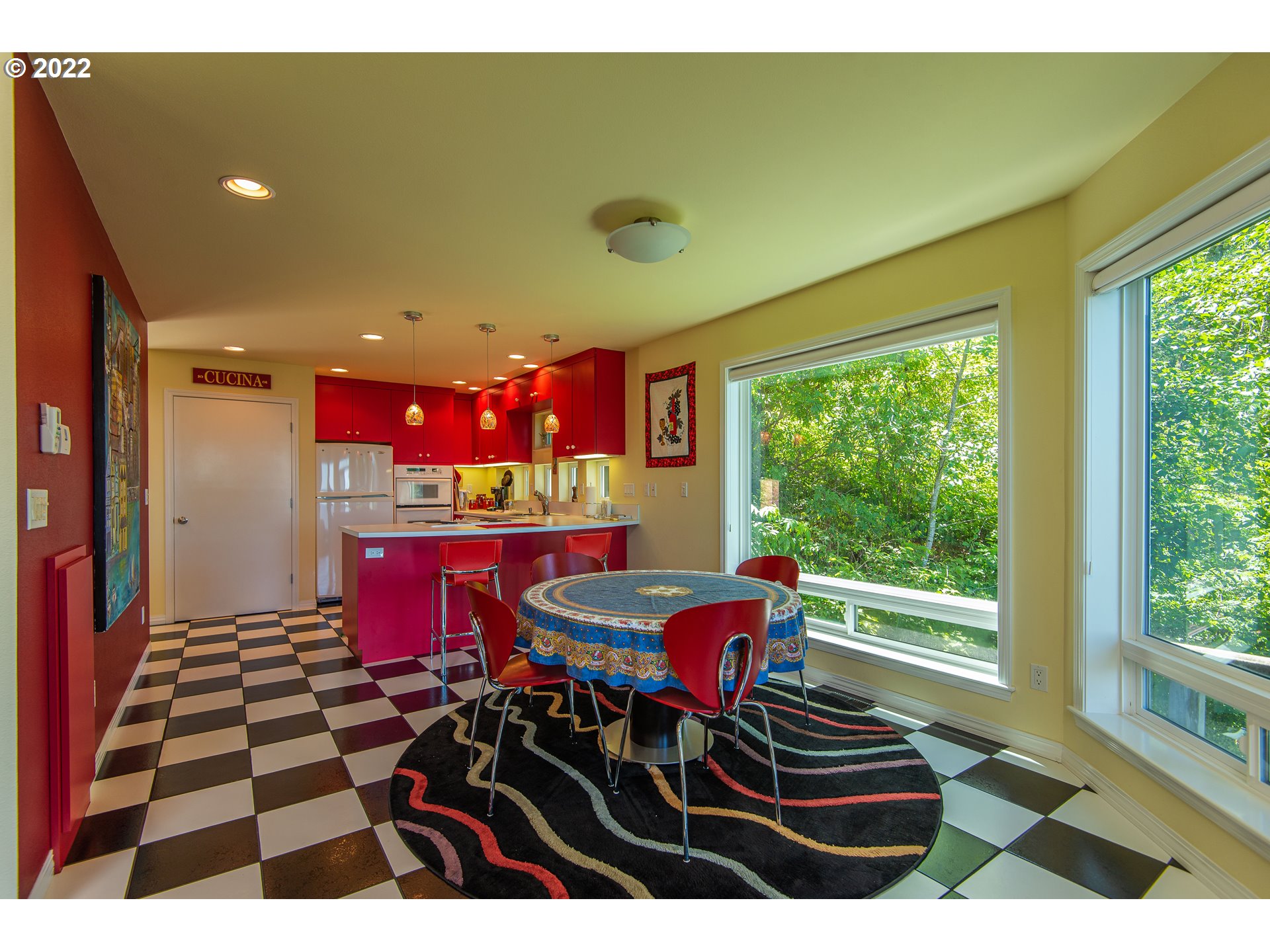 230 Crestview Drive Yachats, OR 97498 - Photo 19 of 31 a view of a dining room with furniture a rug and wooden floor