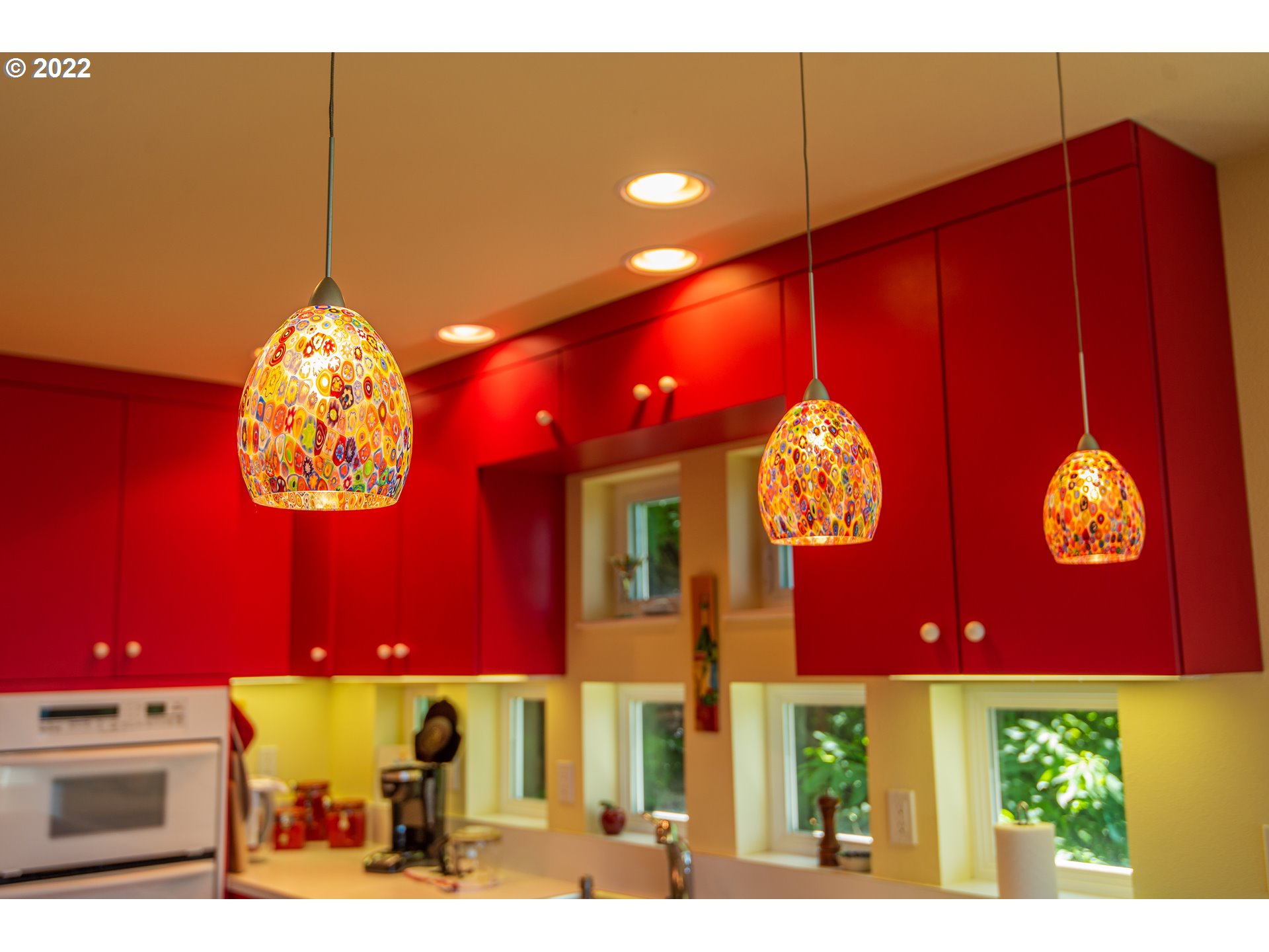 230 Crestview Drive Yachats, OR 97498 - Photo 22 of 31 a view of a brick wall with paintings on the wall