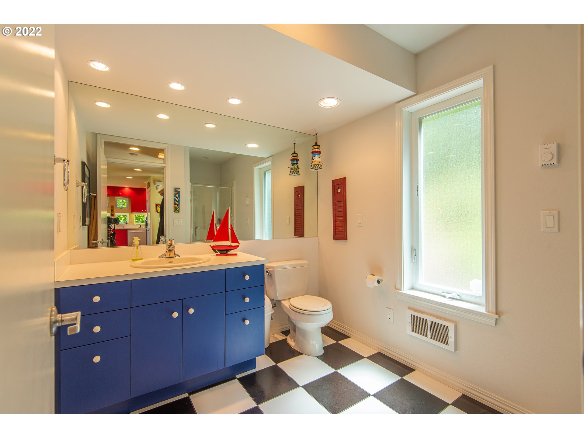 230 Crestview Drive Yachats, OR 97498 - Photo 28 of 31 a bathroom with a sink a toilet and a mirror