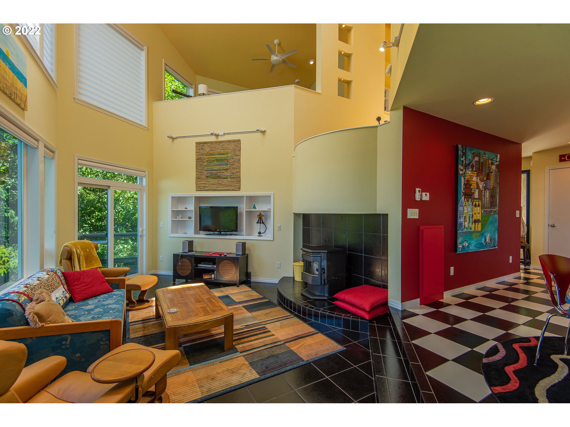 230 Crestview Drive Yachats, OR 97498 - Photo 10 of 31 a bedroom with furniture and a fireplace