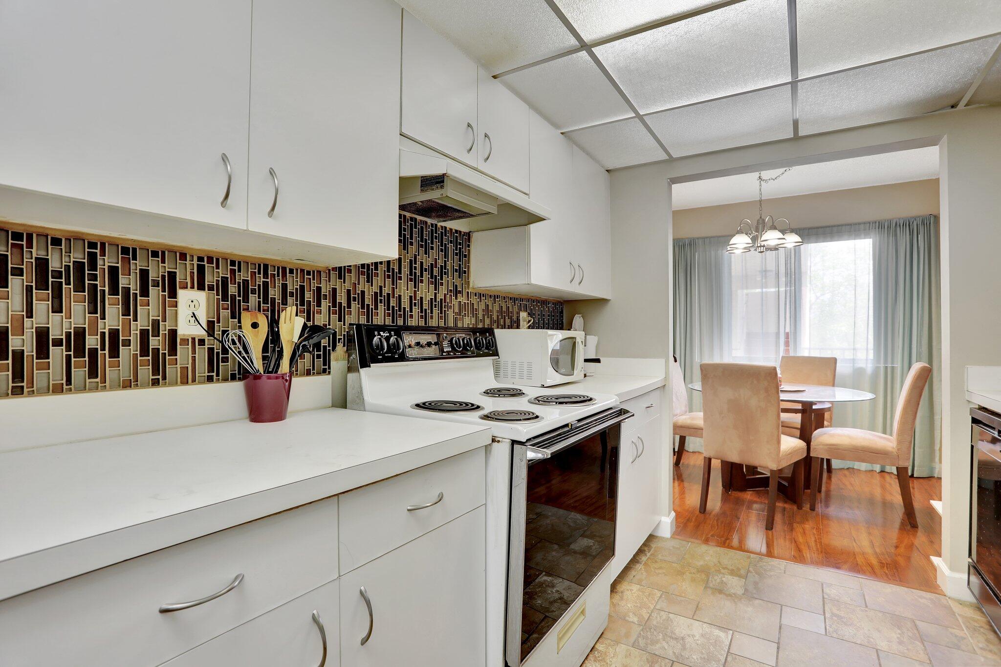 7451 Northwest 16th Street, Unit 303 Plantation, FL 33313 - Photo 13 of 41 a kitchen with a sink and cabinets