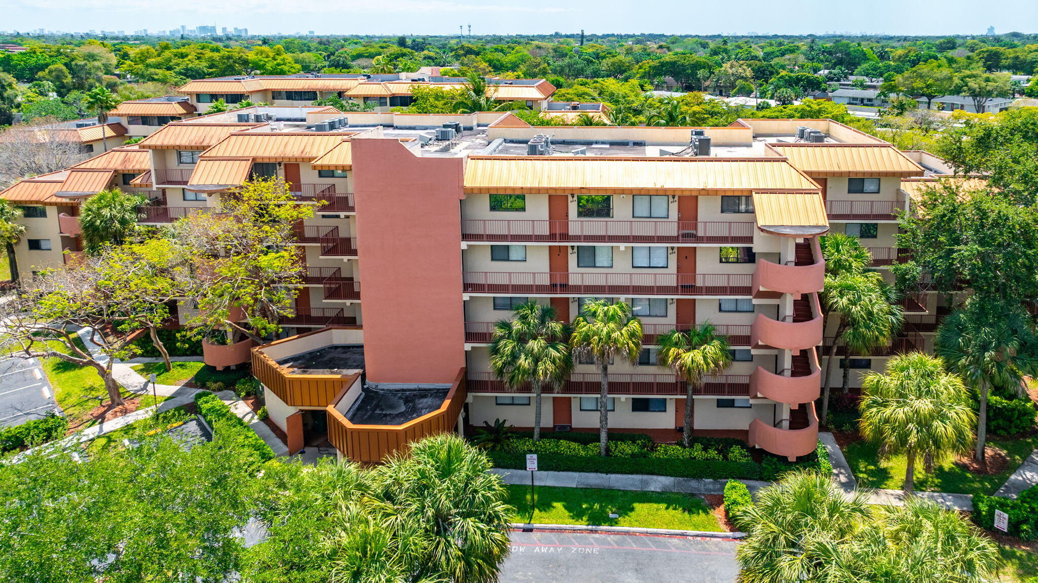 7451 Northwest 16th Street, Unit 303 Plantation, FL 33313 - Photo 2 of 41 an aerial view of a house with a yard and outdoor seating