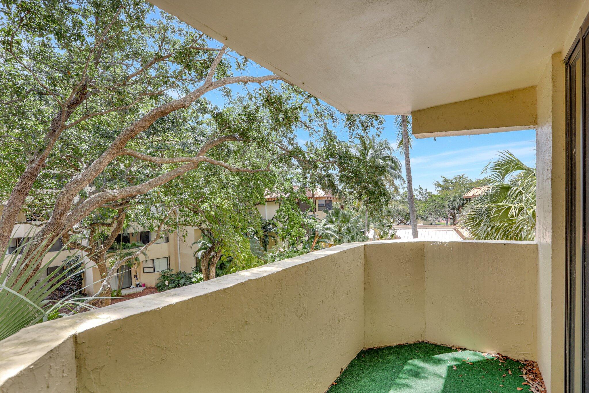7451 Northwest 16th Street, Unit 303 Plantation, FL 33313 - Photo 26 of 41 a view of a garden from a balcony