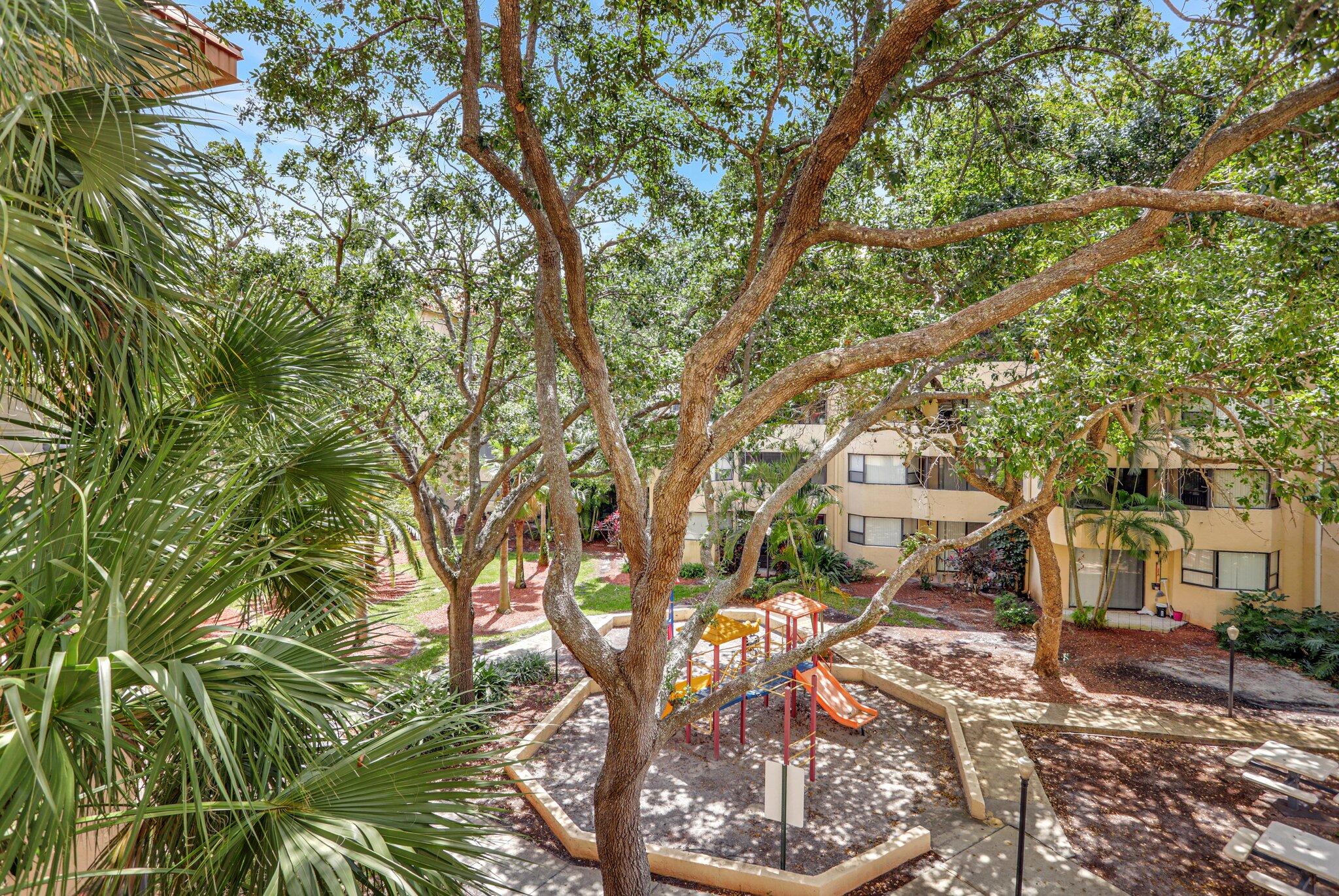 7451 Northwest 16th Street, Unit 303 Plantation, FL 33313 - Photo 28 of 41 a view of a city with lush green forest