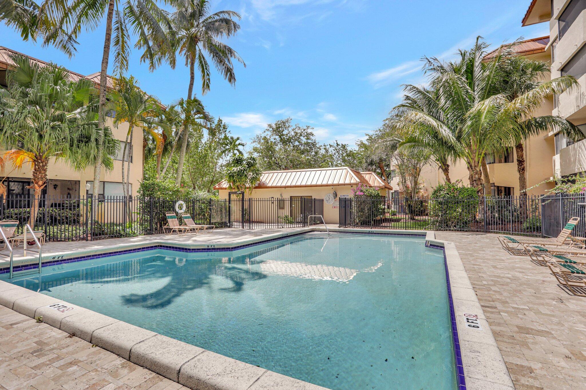 7451 Northwest 16th Street, Unit 303 Plantation, FL 33313 - Photo 32 of 41 a view of a house with swimming pool and sitting area