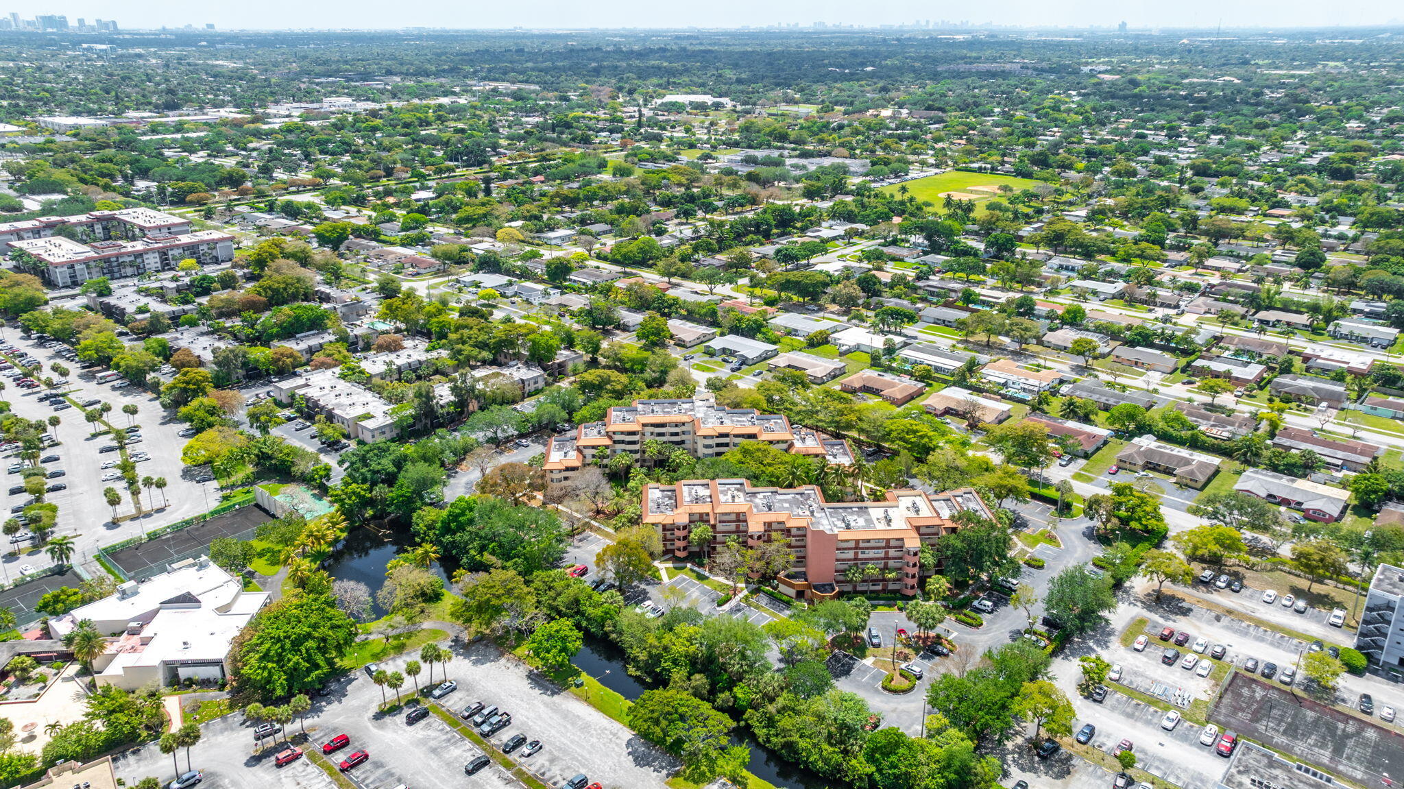 7451 Northwest 16th Street, Unit 303 Plantation, FL 33313 - Photo 37 of 41 an aerial view of residential houses with outdoor space and trees